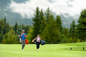 Golfers walking towards the green